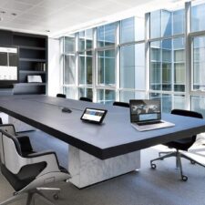 A large boardroom with a Control4 Display.